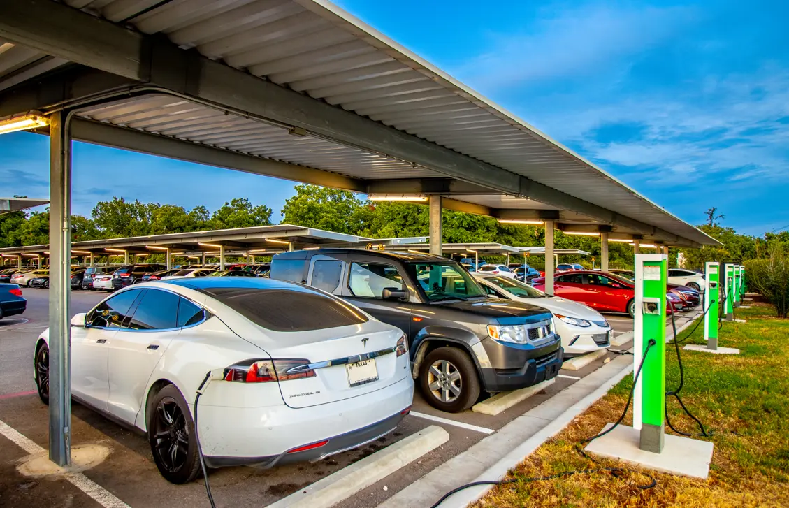 Electric vehicles charging at The Parking Spot Austin East location; charging stations in covered parking