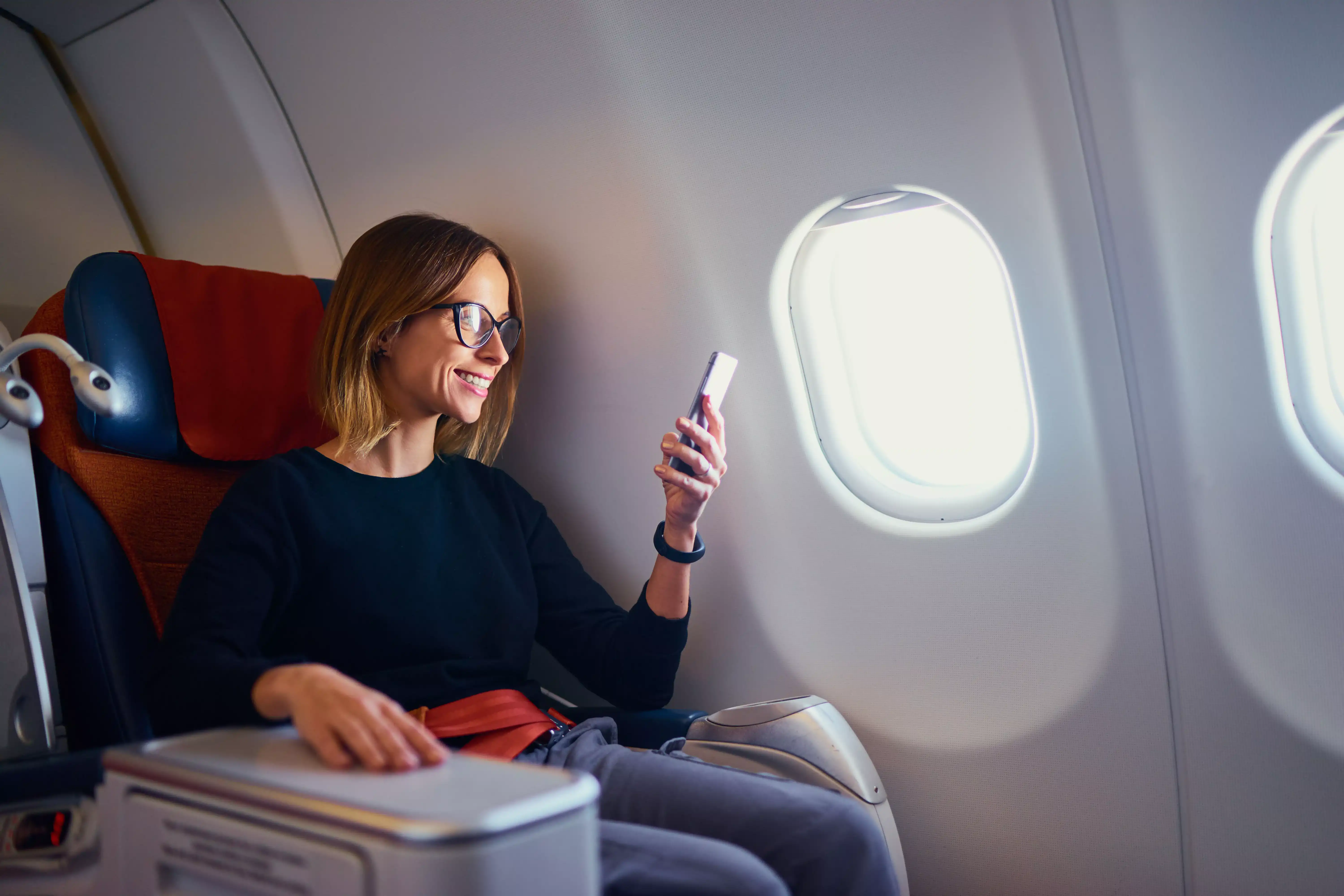 woman in business class airplane seat