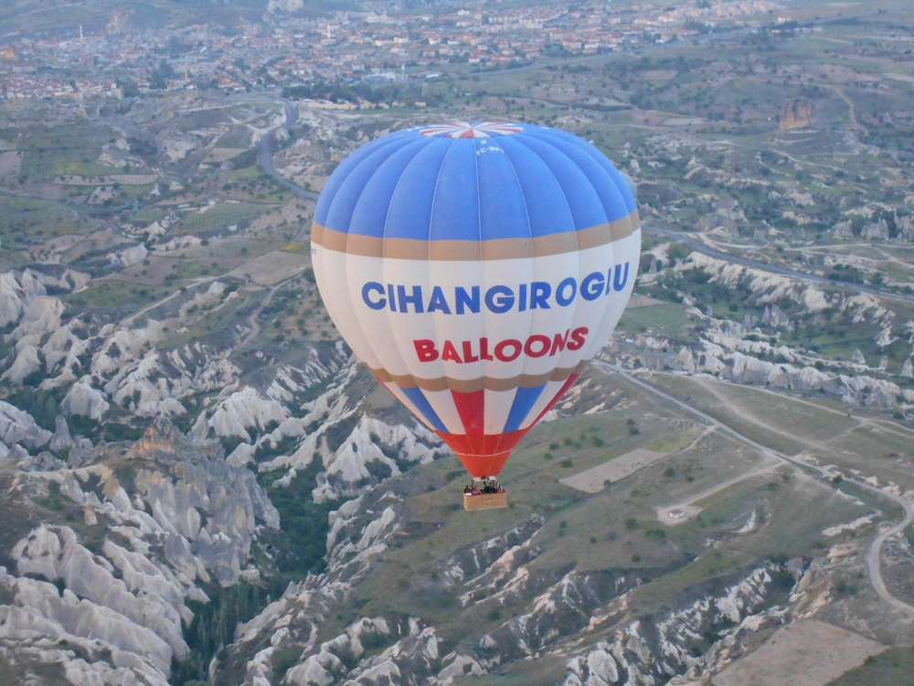 Another balloon near us high above the rugged landscape in Cappadocia. Photo by the author