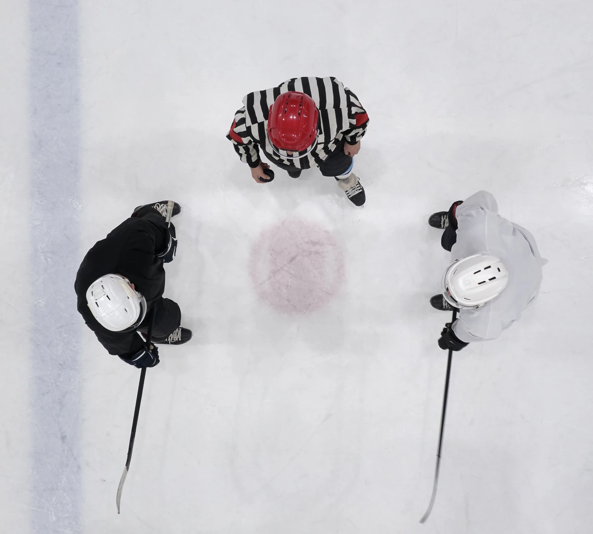 hockey face-off in the center circle