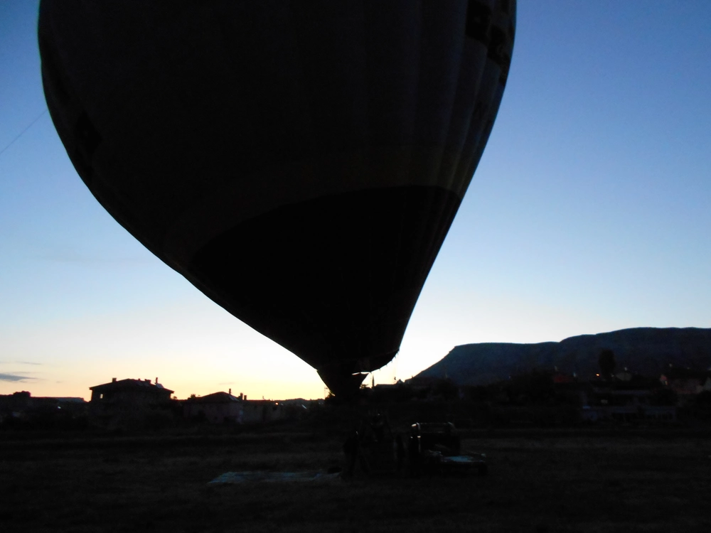 Hot air balloon at the launch site at dawn; photo by the author.