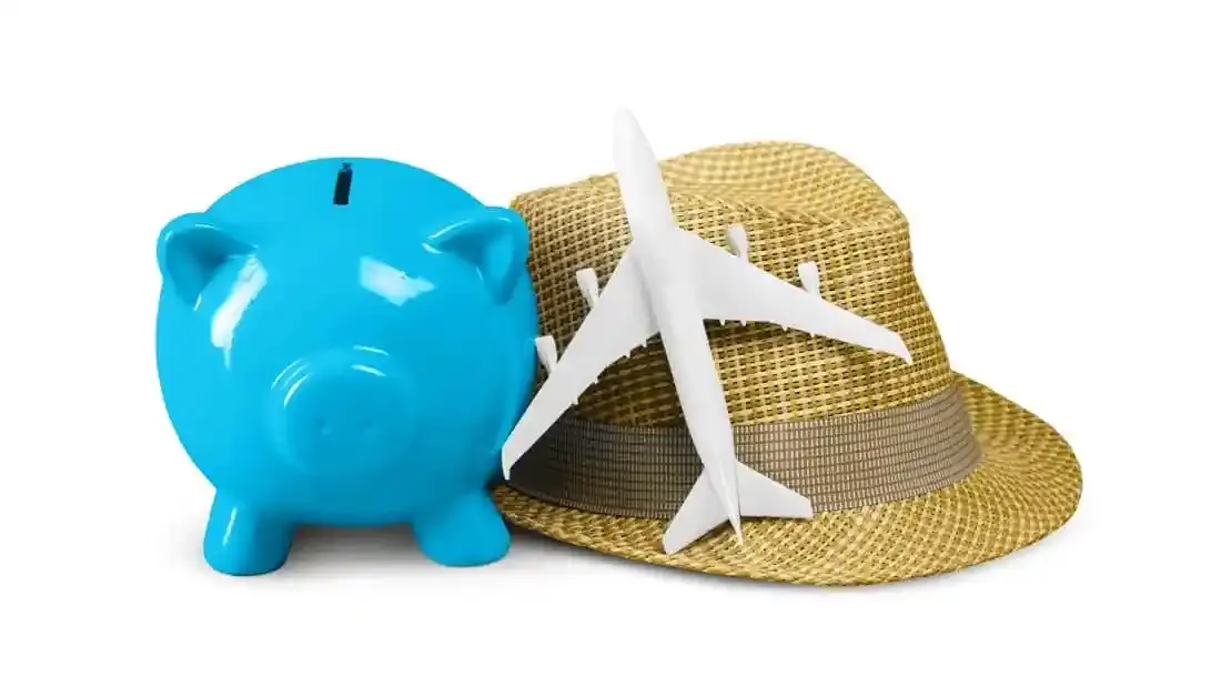 blue coin bank and straw hat