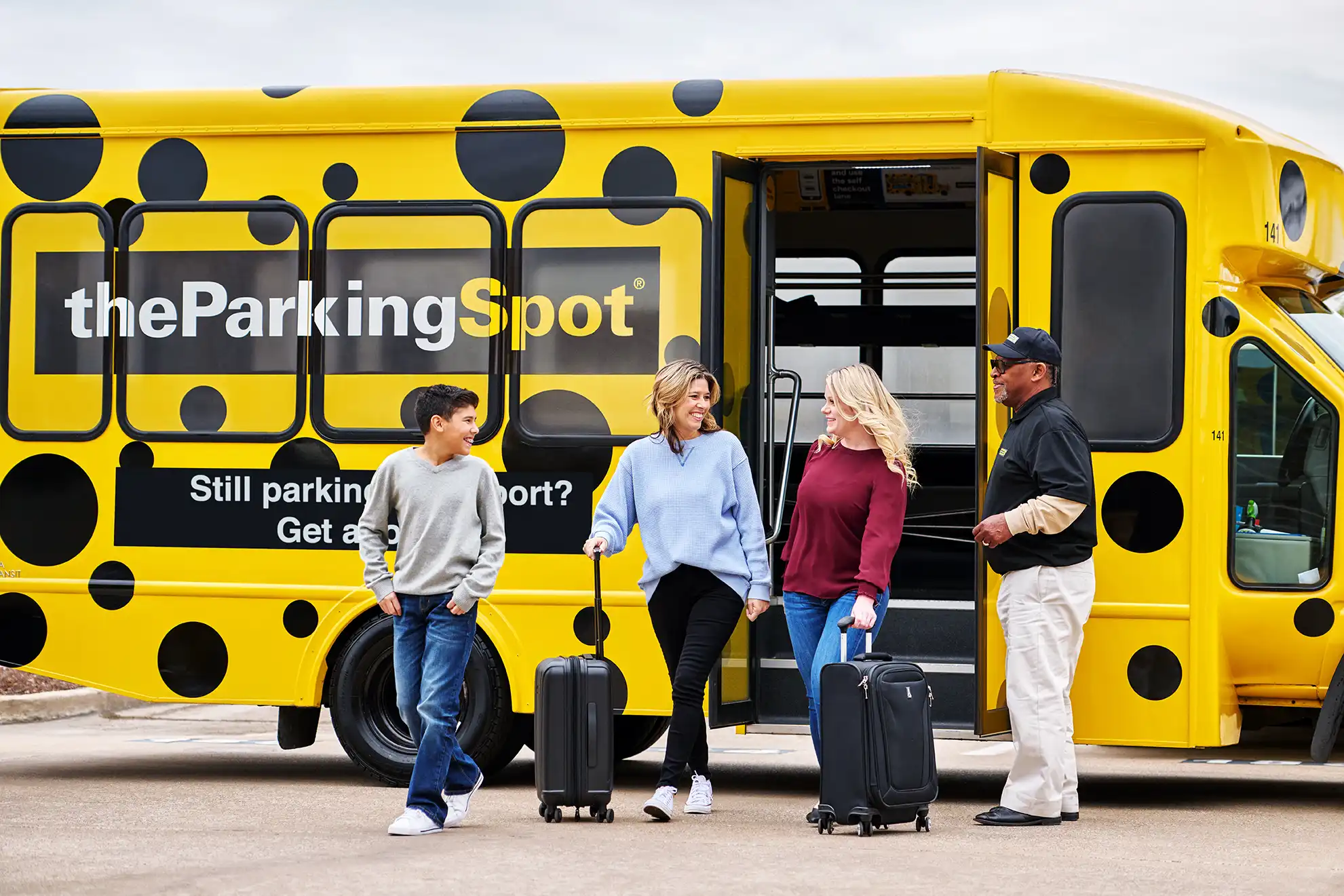 Monthly parkers exiting an airport parking shuttle with their luggage.
