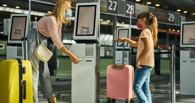 self serve luggage drop off at the check in area in the airport.