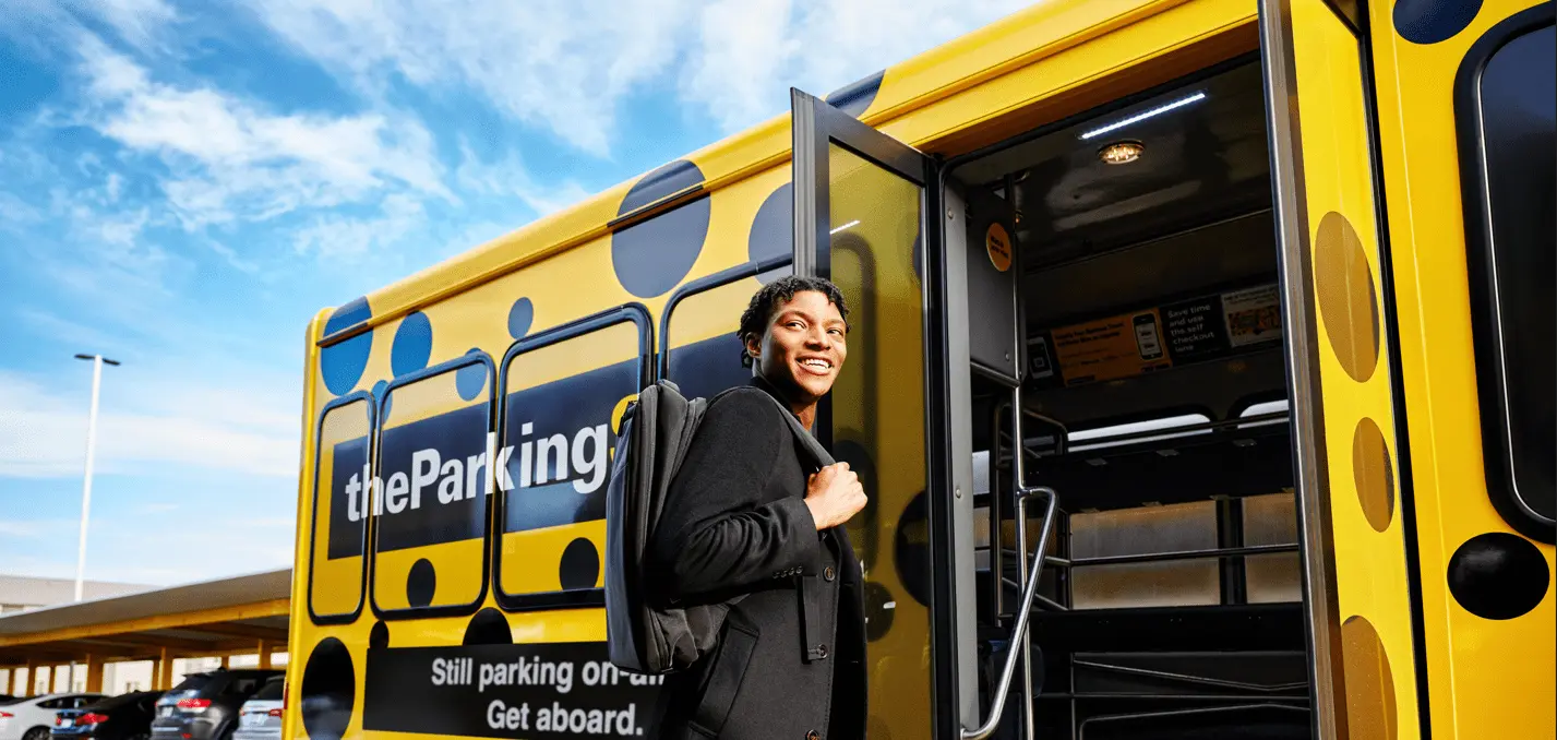 A Parking Spot Guest boards the airport shuttle.