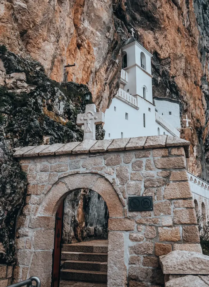 Ostrog Orthodox Monastery built into a cliffside in Montenegro. Photo credit: Zekai Zhu of Pexels.